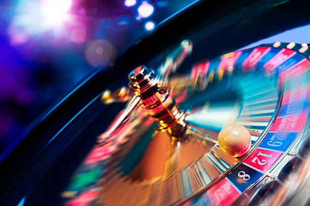 BandarQ card game interface on agen77bet showing player tables and hand rankings